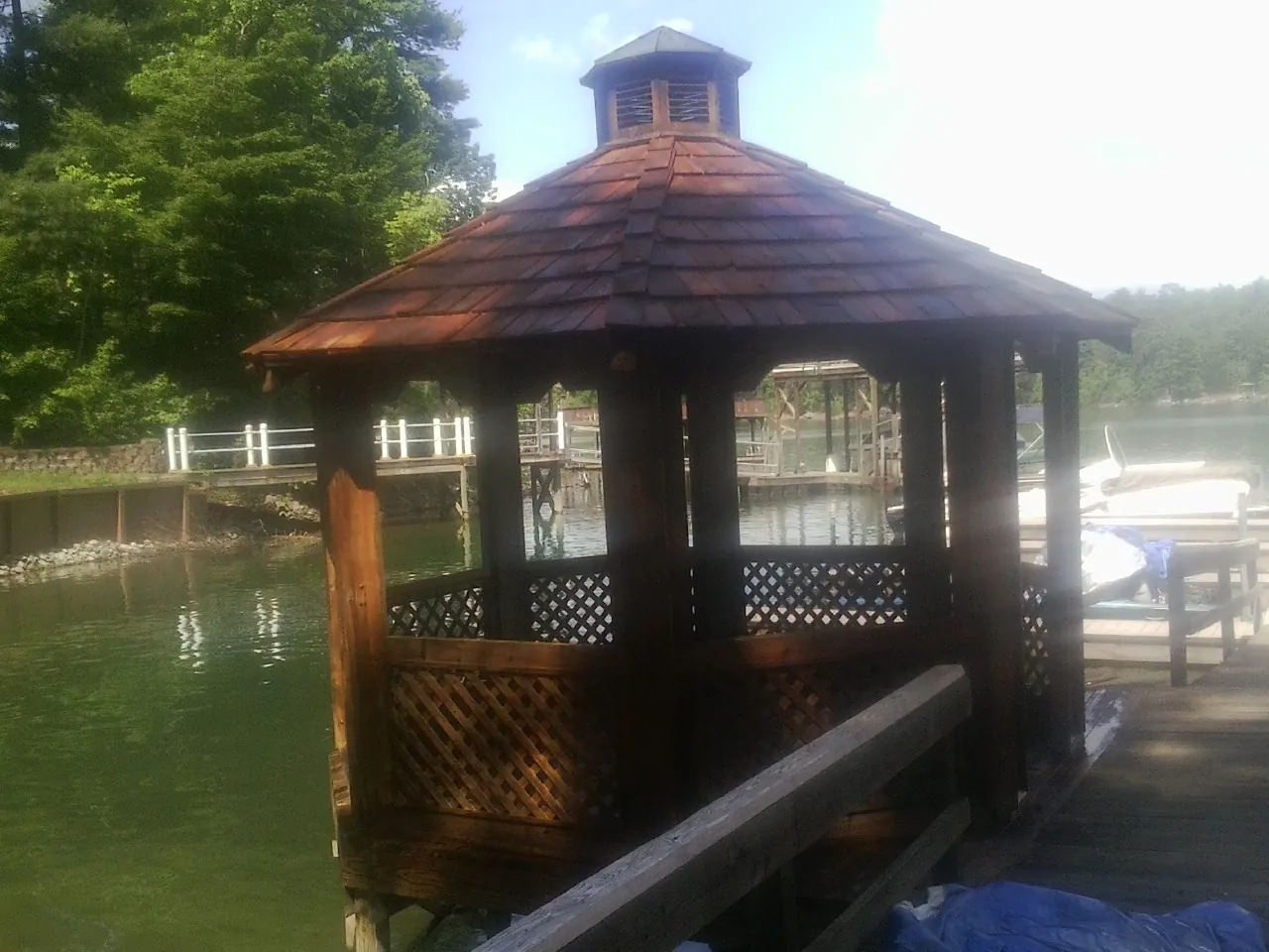 Cedar shake gazebo roof rebuilt on a lake dock in Summitville